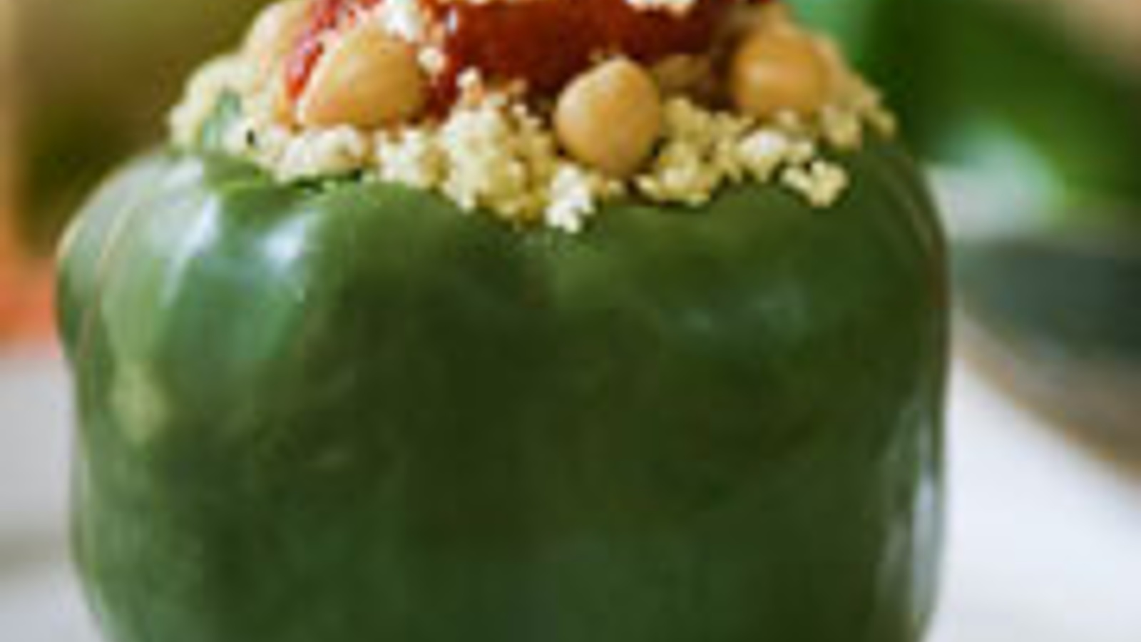 Couscous and garbanzo bean stuffed peppers with goat cheese