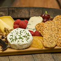 Festive cheese board with orange slices candied in white port