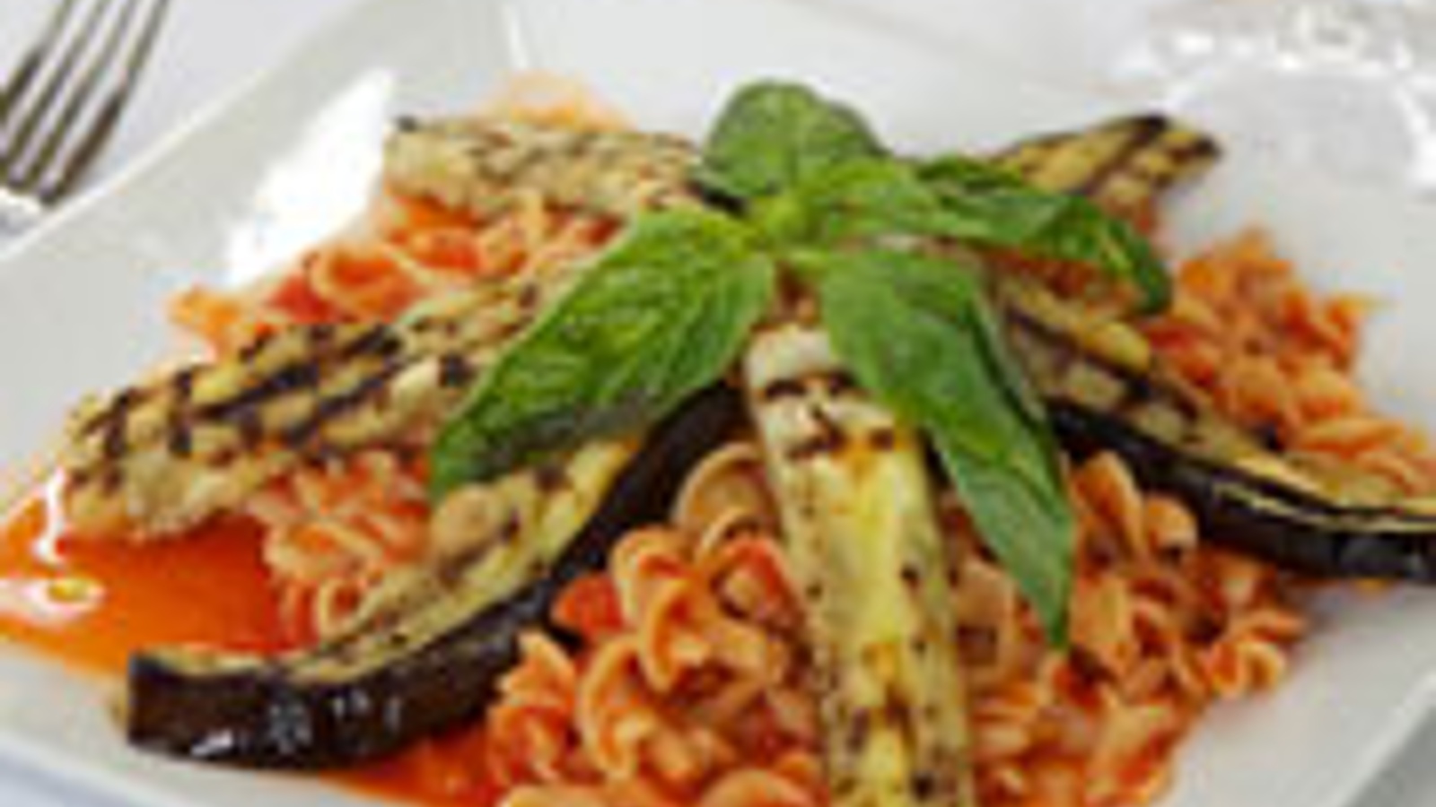 Grilled eggplant over fusilli