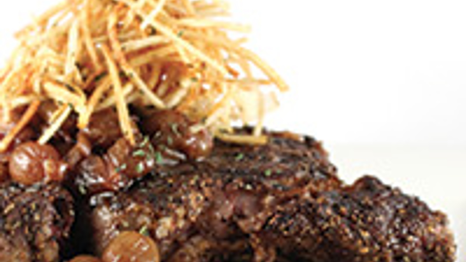 Rib-eye with grilled grape sauce and garlic herb shoestring potatoes