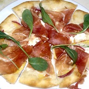 Flatbread (pizza) with peaches, farmers cheese, prosciutto and arugula