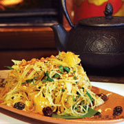 Green papaya salad with raisins, lime and chile-garlic sauce