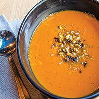 Roasted carrot soup with sunflower seed crumble