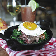 Brunch steak with chimichurri sauce and egg