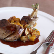 Grilled pork chop with pomegranate molasses and butternut squash "hash"