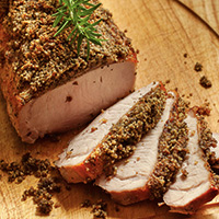 Roasted pork loin with a garlic, rosemary and walnut crust