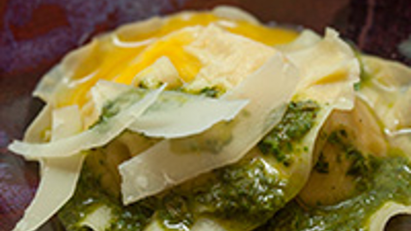 Whole egg and potato ravioloni with fried herb salsa verde