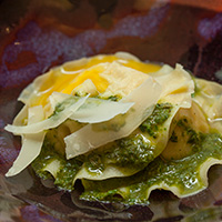 Whole egg and potato ravioloni with fried herb salsa verde