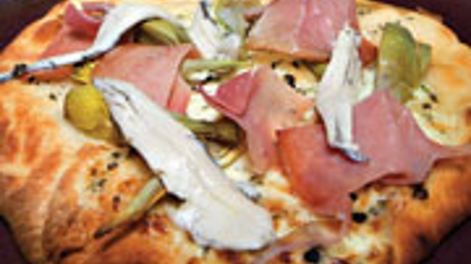 Baby artichoke flatbread with anchovies and prosciutto