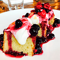 California olive oil cake with Chantilly cream and seasonal fruit