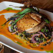 Pan roasted chicken breast with rice and sauvignon blanc-carrot reduction