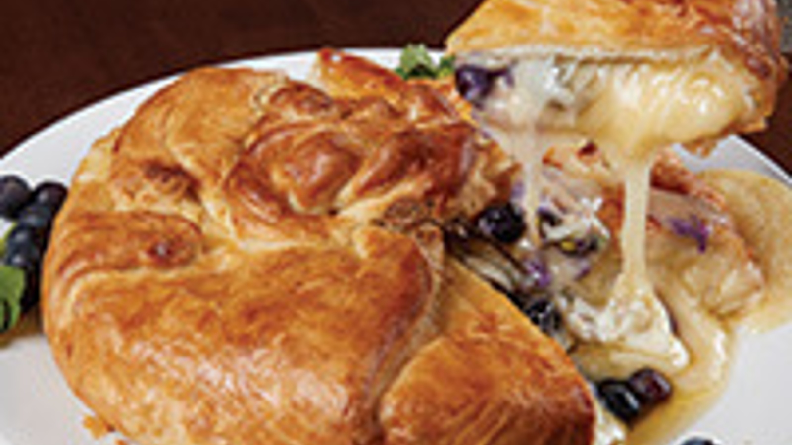 Brie en croute with blueberries and pistachios