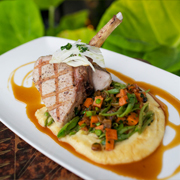 Pork chop with succotash, polenta and caramelized fennel sauce